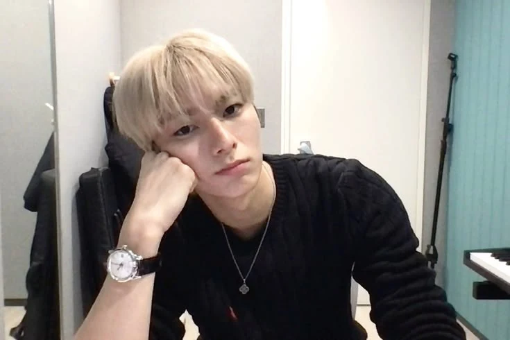 Natha resting his cheek on his hand